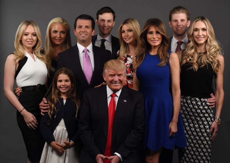 Members of the Trump family pose for a photo in New York in April 2016. Behind Trump, from left, are daughter Tiffany, daughter-in-law Vanessa, granddaughter Kai Madison, son Donald Jr., son-in-law Jared Kushner, daughter Ivanka, wife Melania, son Eric and daughter-in-law Lara.