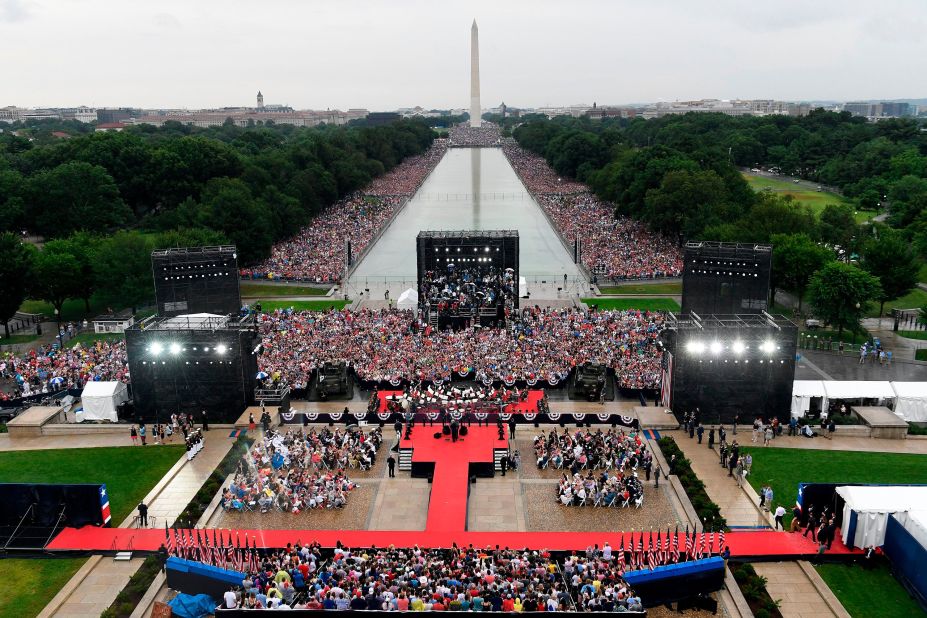 Crowds gather around the Lincoln Memorial Reflecting Pool to watch Trump speak in July 2019. <a href=