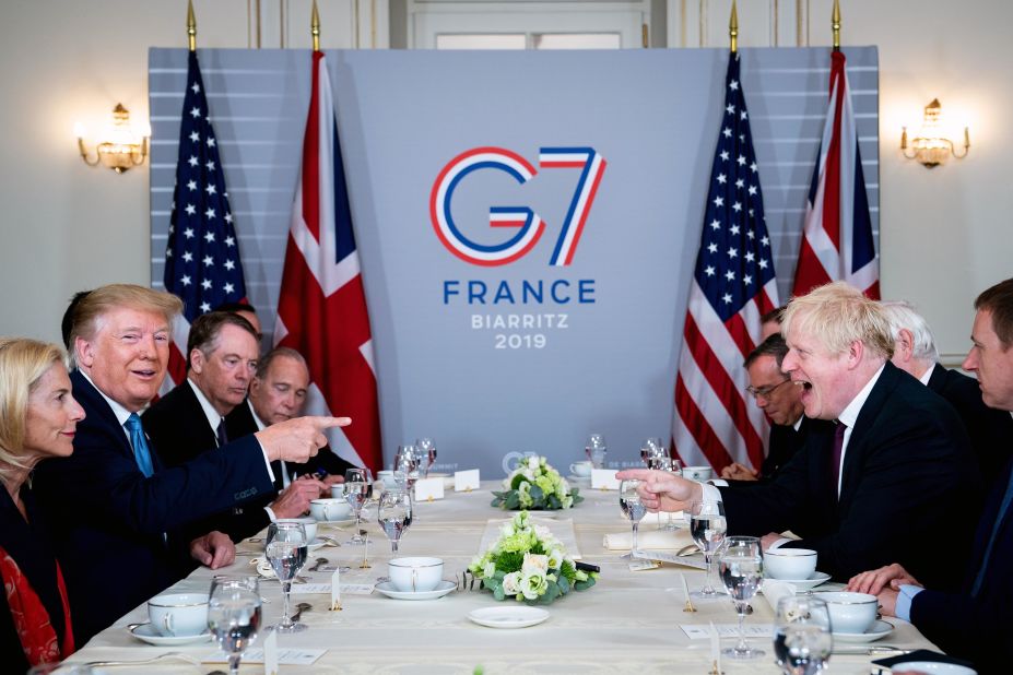 Trump shares a laugh with UK Prime Minister Boris Johnson during a working breakfast at the G-7 summit in Biarritz, France, in August 2019.