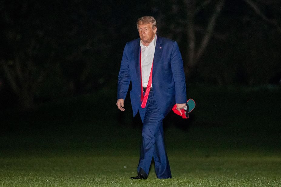 Trump walks on the South Lawn of the White House <a href=