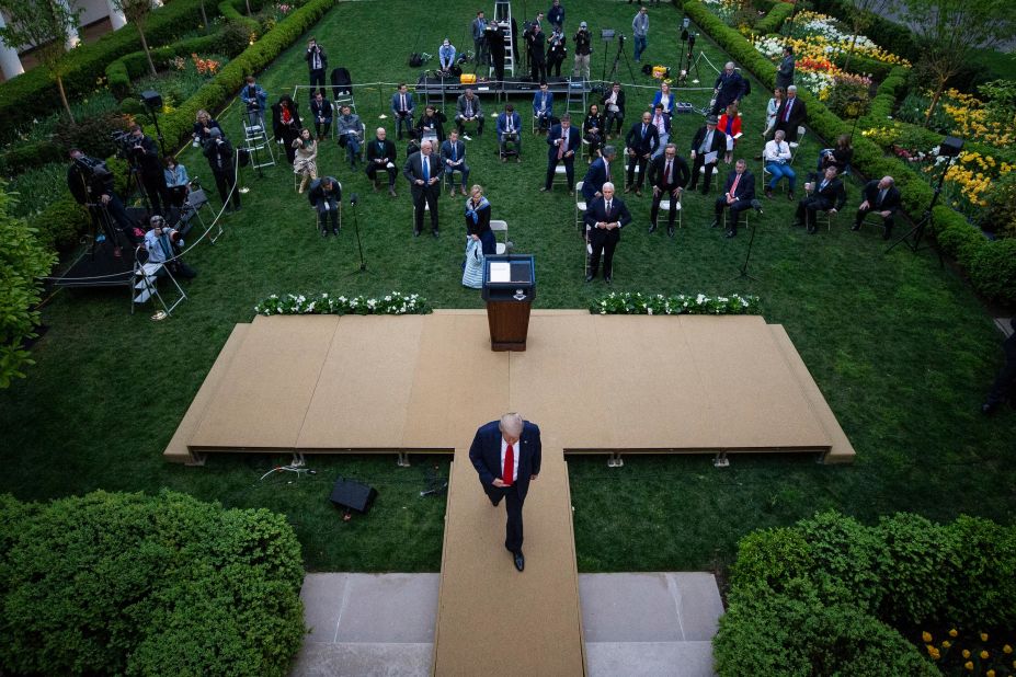 Trump leaves the White House Rose Garden following a coronavirus briefing in April 2020. During the briefing, Trump threatened to leave after Playboy correspondent and CNN analyst Brian Karem attempted to ask a question about social distancing. 